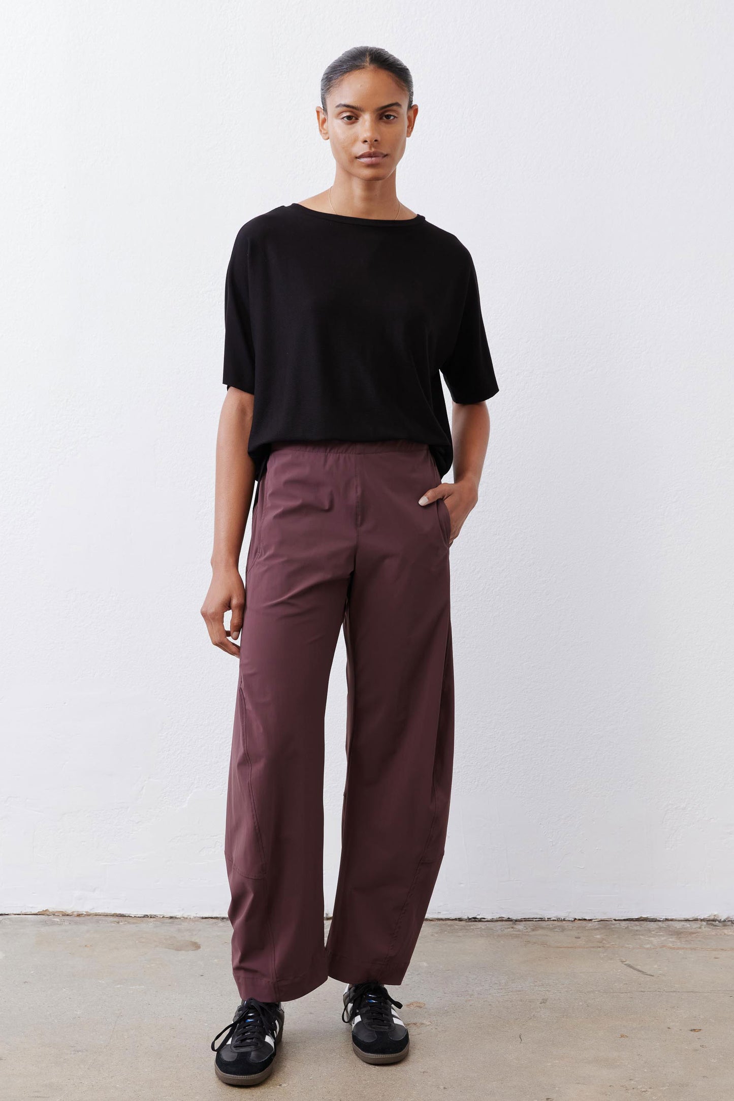 Black crew-neck short-sleeve top with front plain finish