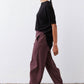 Black short-sleeve top with back button placket and side drape