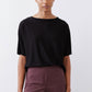 Black short-sleeve crew-neck top with relaxed, straight silhouette
