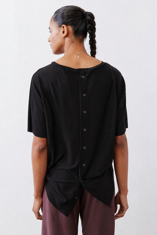 Black short-sleeve button back top with twisted back hem detail