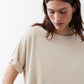Cloud cream short-sleeve top with crew neck and side cuff detail