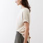 Cloud cream short-sleeve top in side view, crew neckline and relaxed hem