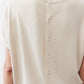 Cloud cream back of top showing vertical button placket and button rows
