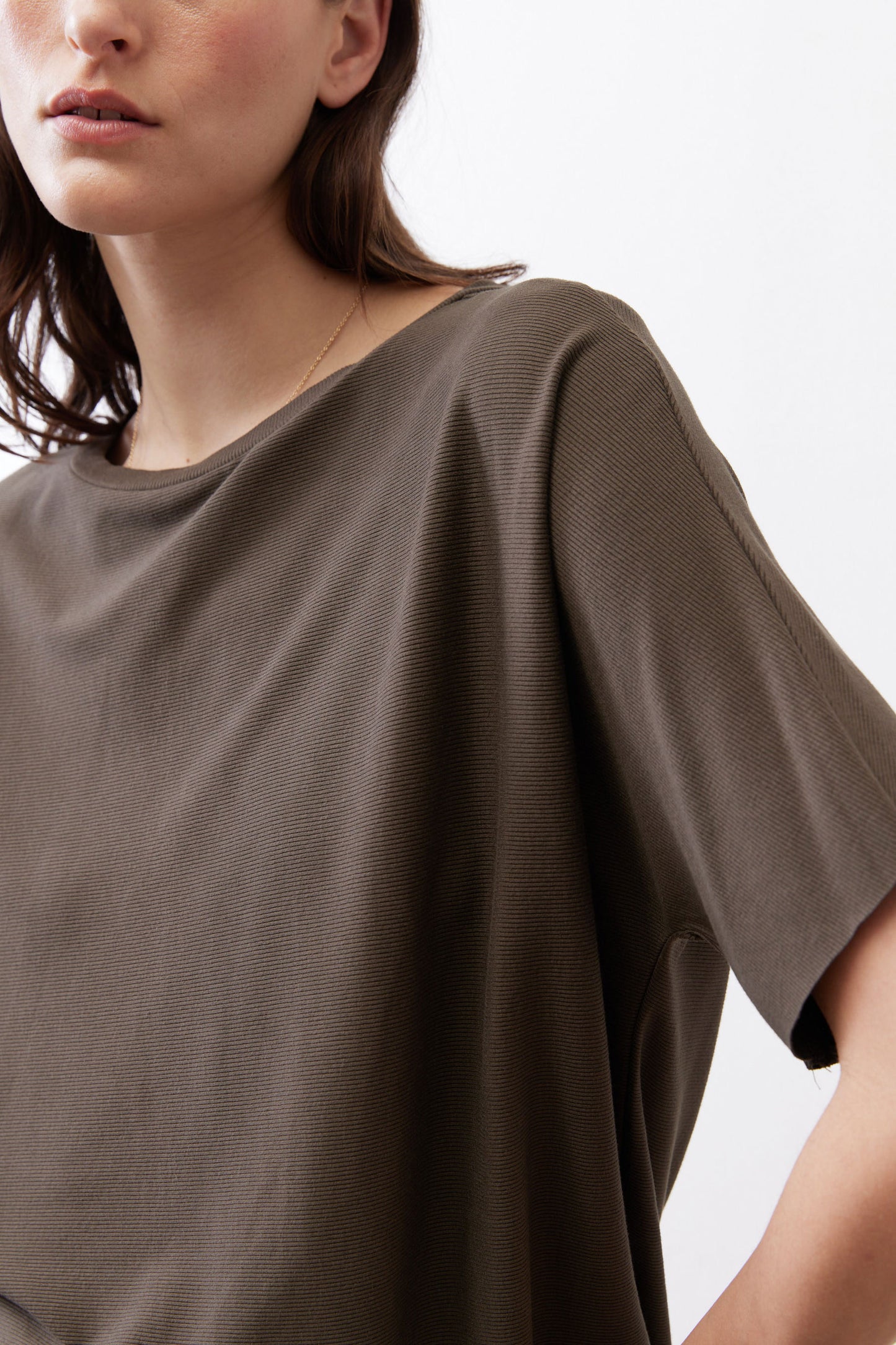 Olive short-sleeve knit top with textured weave and loose drape