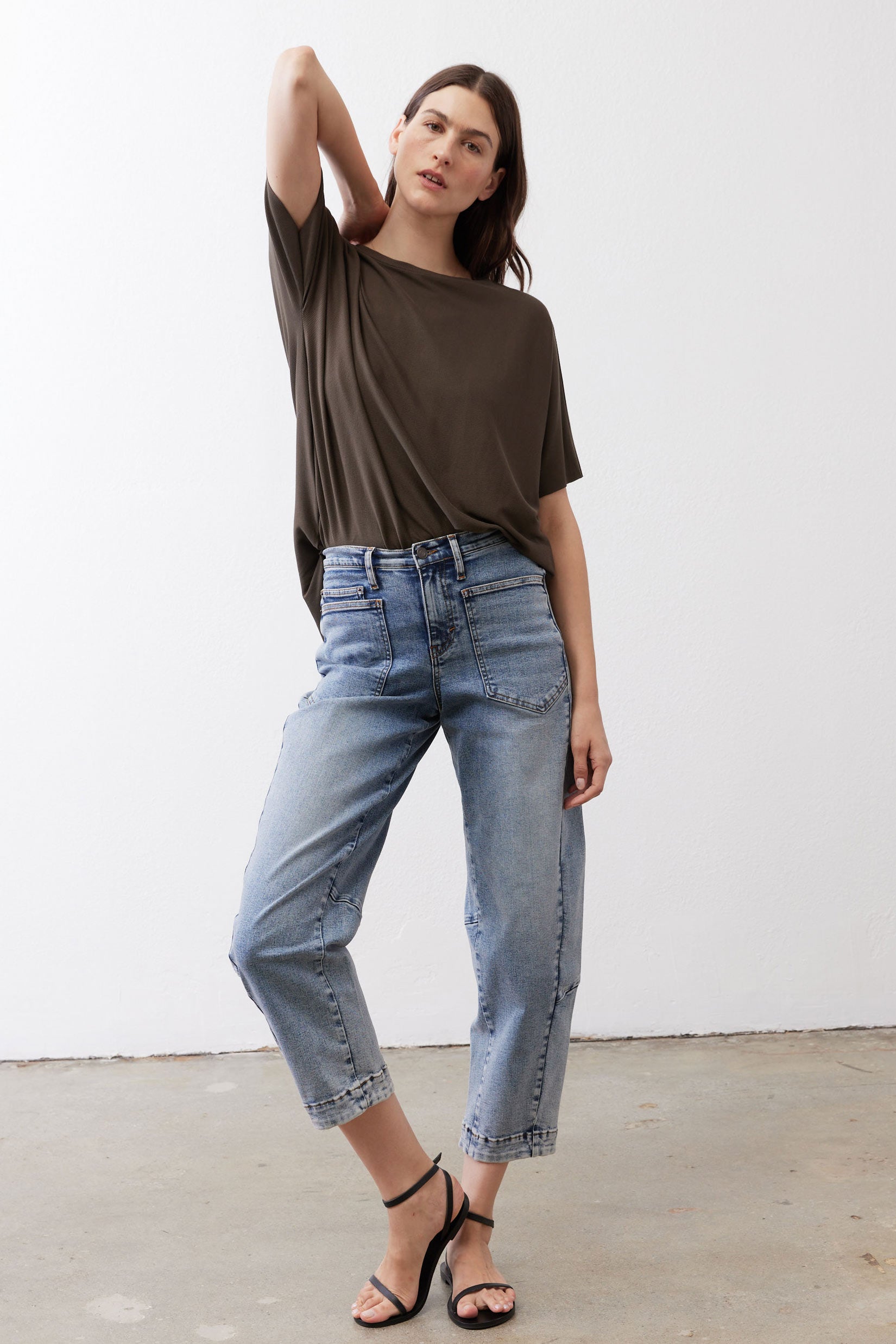 Olive short-sleeve pullover top with relaxed hemline and casual drape