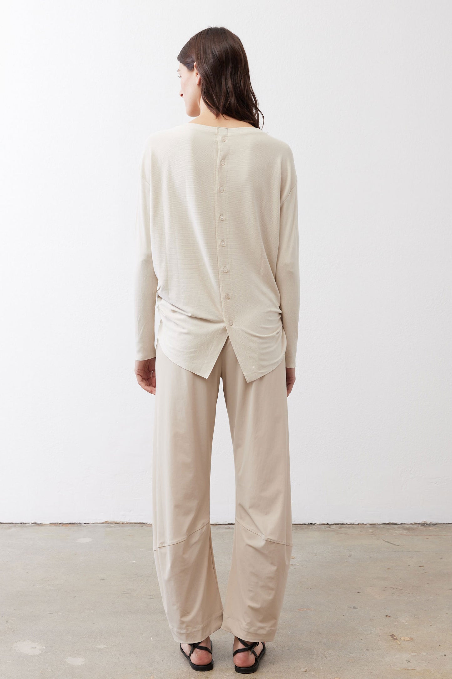 Cloud button-back long-sleeve top, back view with buttoned seam