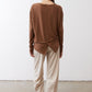 Button-back top in deep brown, long sleeves, crew neck, button placket detail