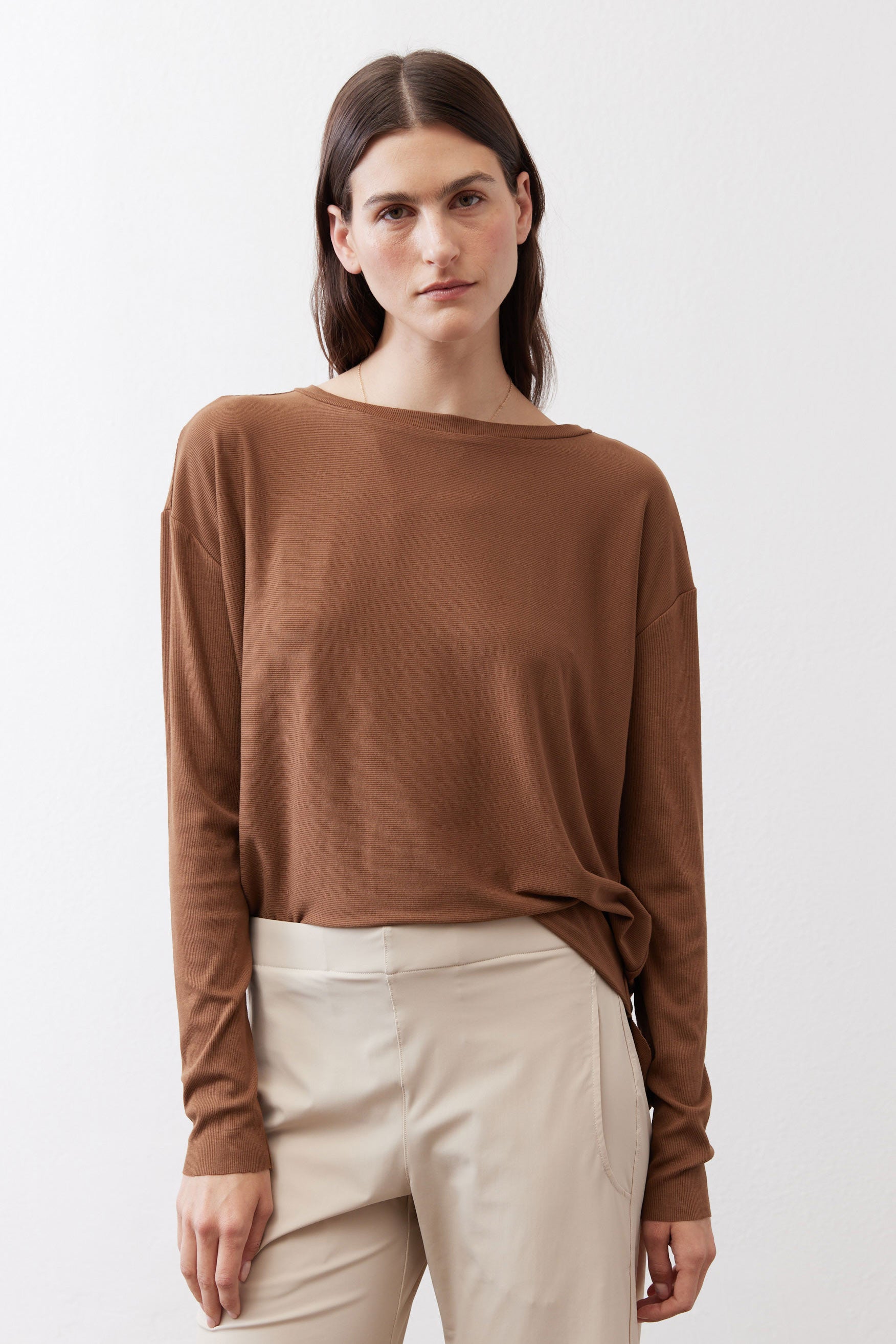 Deep brown crew-neck long-sleeve top with relaxed fit, front view