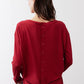 Garnet button-back top with twisted front hem