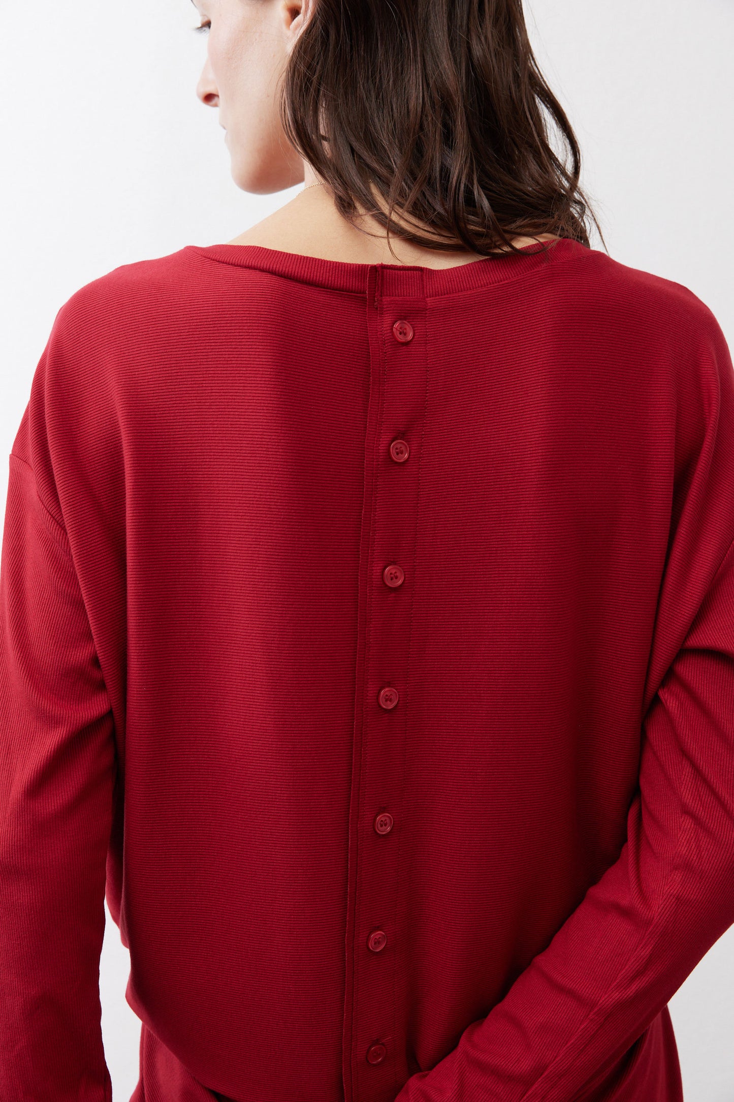 Garnet button-back long-sleeve top, button placket at back yoke
