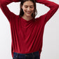 Garnet long-sleeve crewneck top with relaxed fit