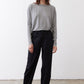 Gray melange long-sleeve crewneck top with straight hem, worn front
