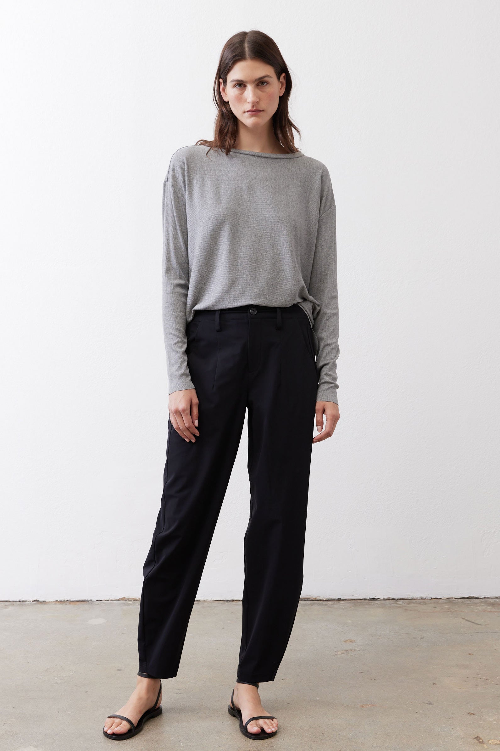 Gray melange long-sleeve crewneck top with straight hem, worn front
