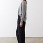 Gray melange long-sleeve crewneck top with knotted hem detail, side view