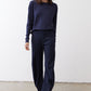 Deep navy long-sleeve top with round neckline and straight hem