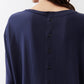 Deep navy long-sleeve top back with vertical button placket close-up