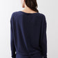 Deep navy long-sleeve top back view with button placket and knotted hem