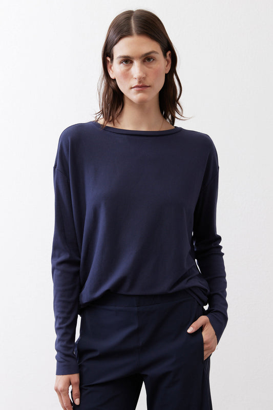 Navy long-sleeve essential top with crew neck and button-back detail.