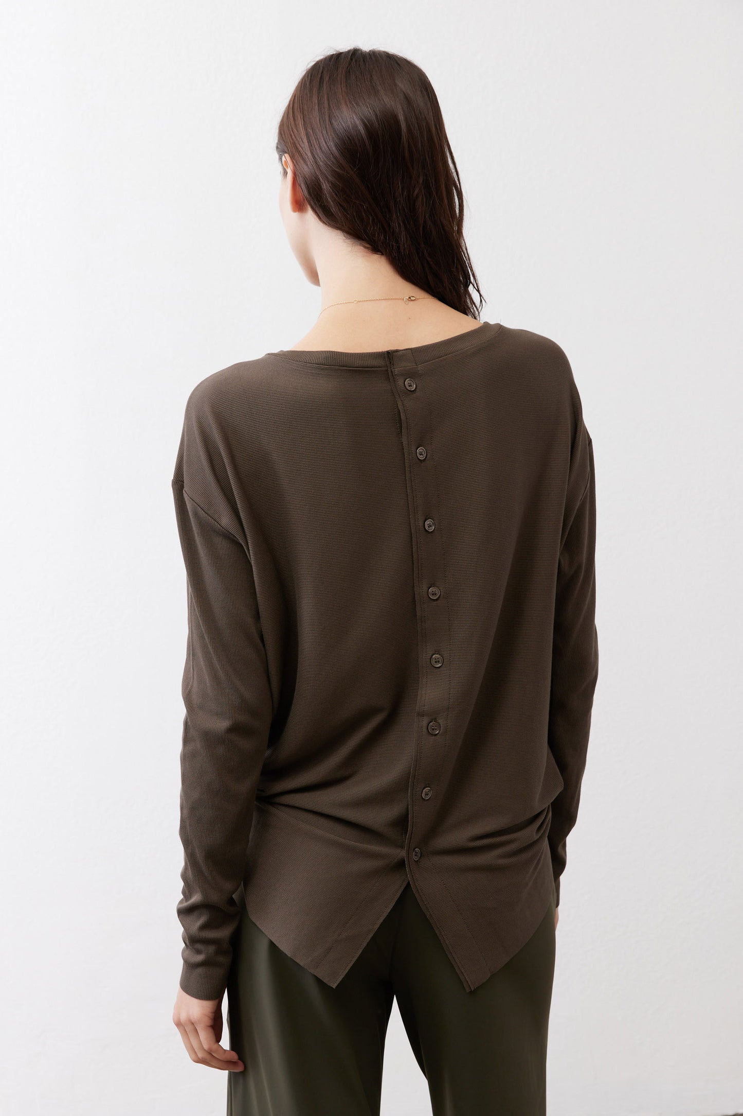 Essential button-back top showing back buttons, long sleeves in dark olive