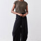 Black wide-leg pants with elastic waistband and relaxed fit with side pockets
