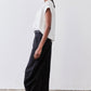 Black wide-leg pants with elastic waistband and relaxed straight legs to ankle hem
