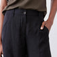 Black wide-leg pants with elastic waistband and buttoned front detail