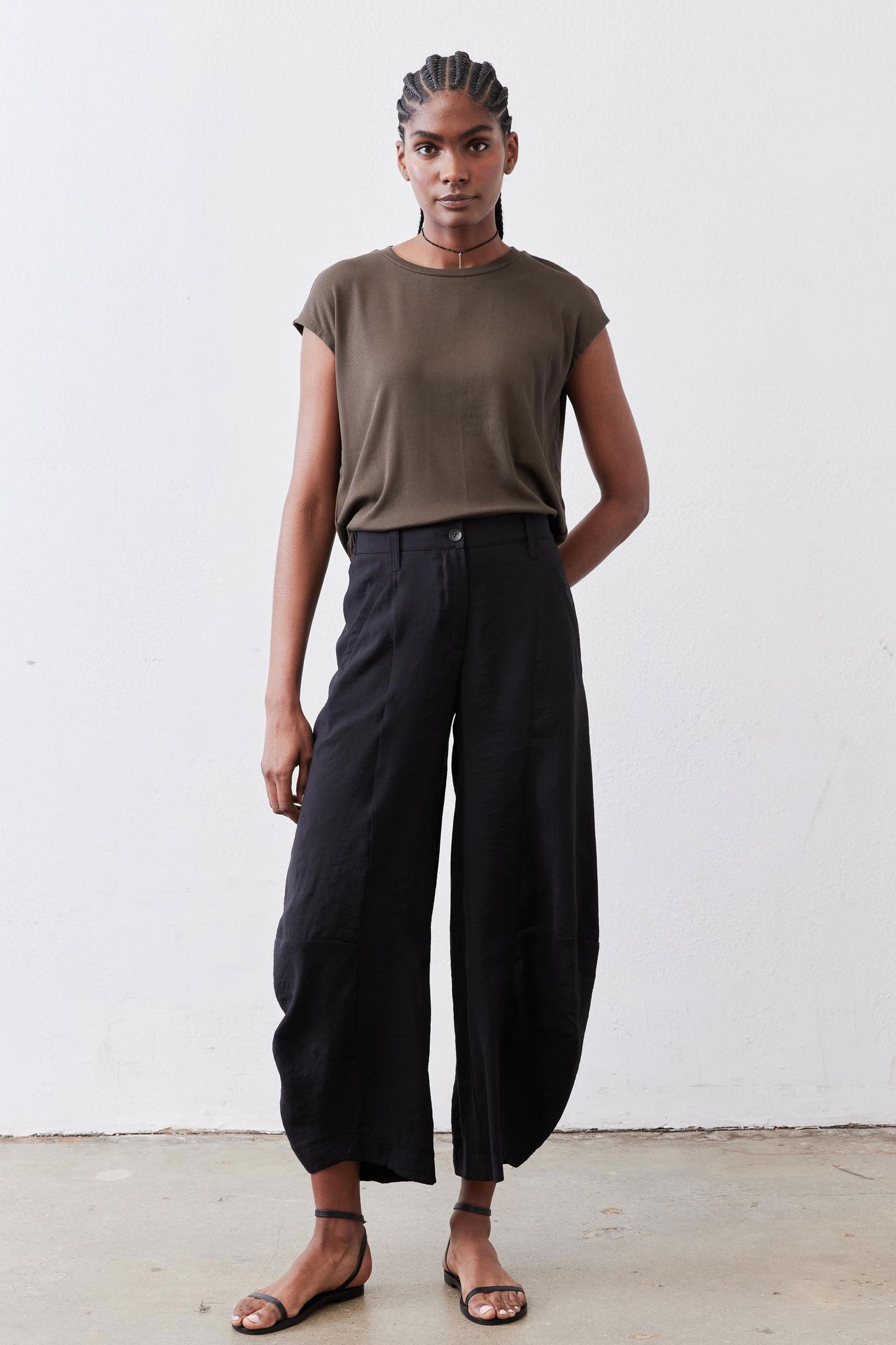 Black wide-leg pants with elastic waistband, ankle-length hem, and relaxed fit