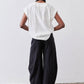 Black wide-leg pants with elastic waistband, back view, relaxed drape to ankle hem