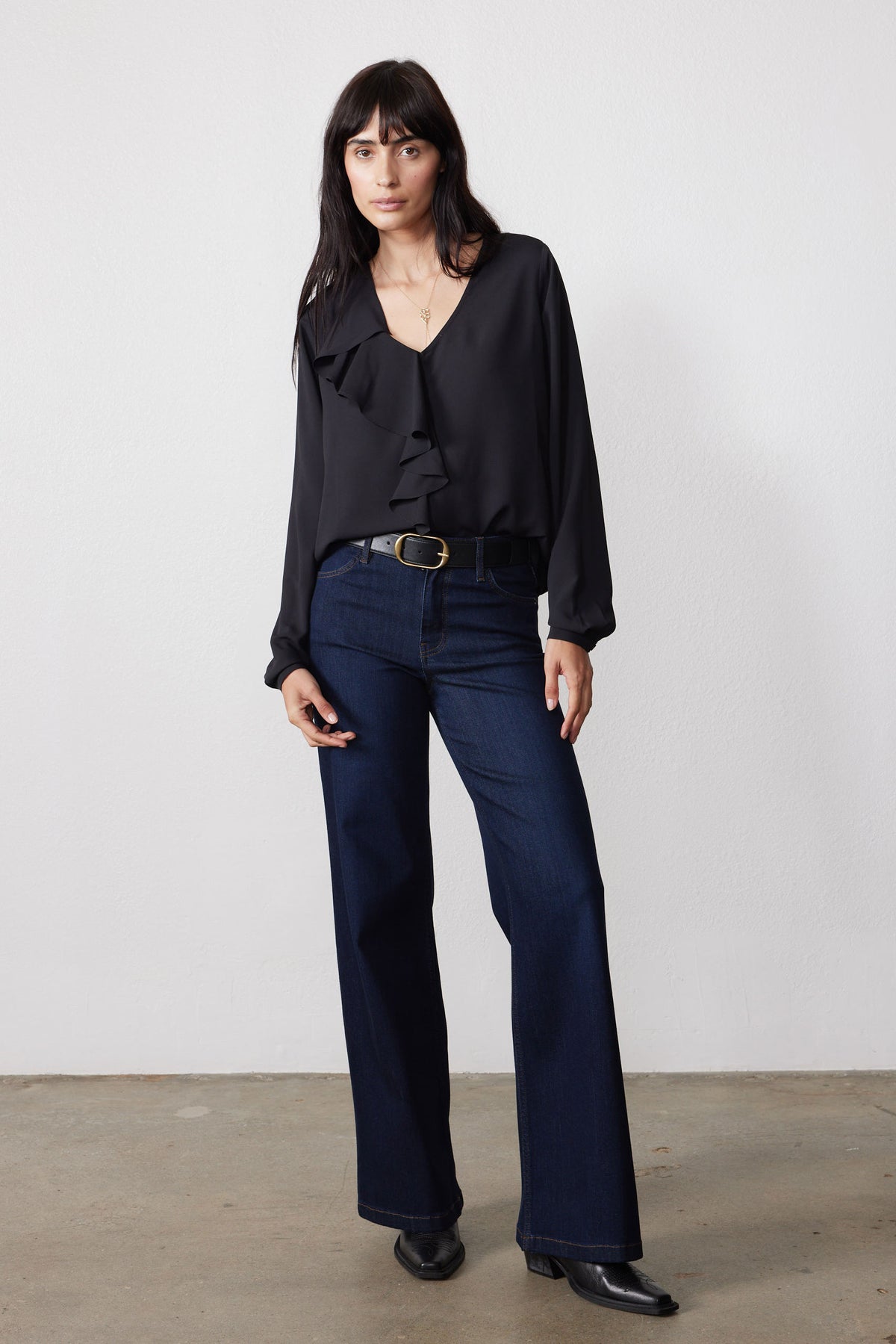 Black flounce V-neck top with long sleeves and layered ruffle front