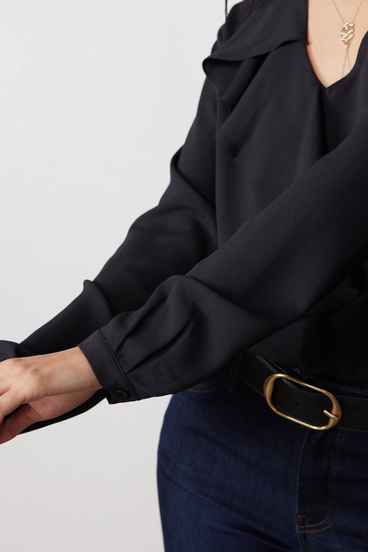 Black long-sleeve V-neck top sleeve and flounce front detail