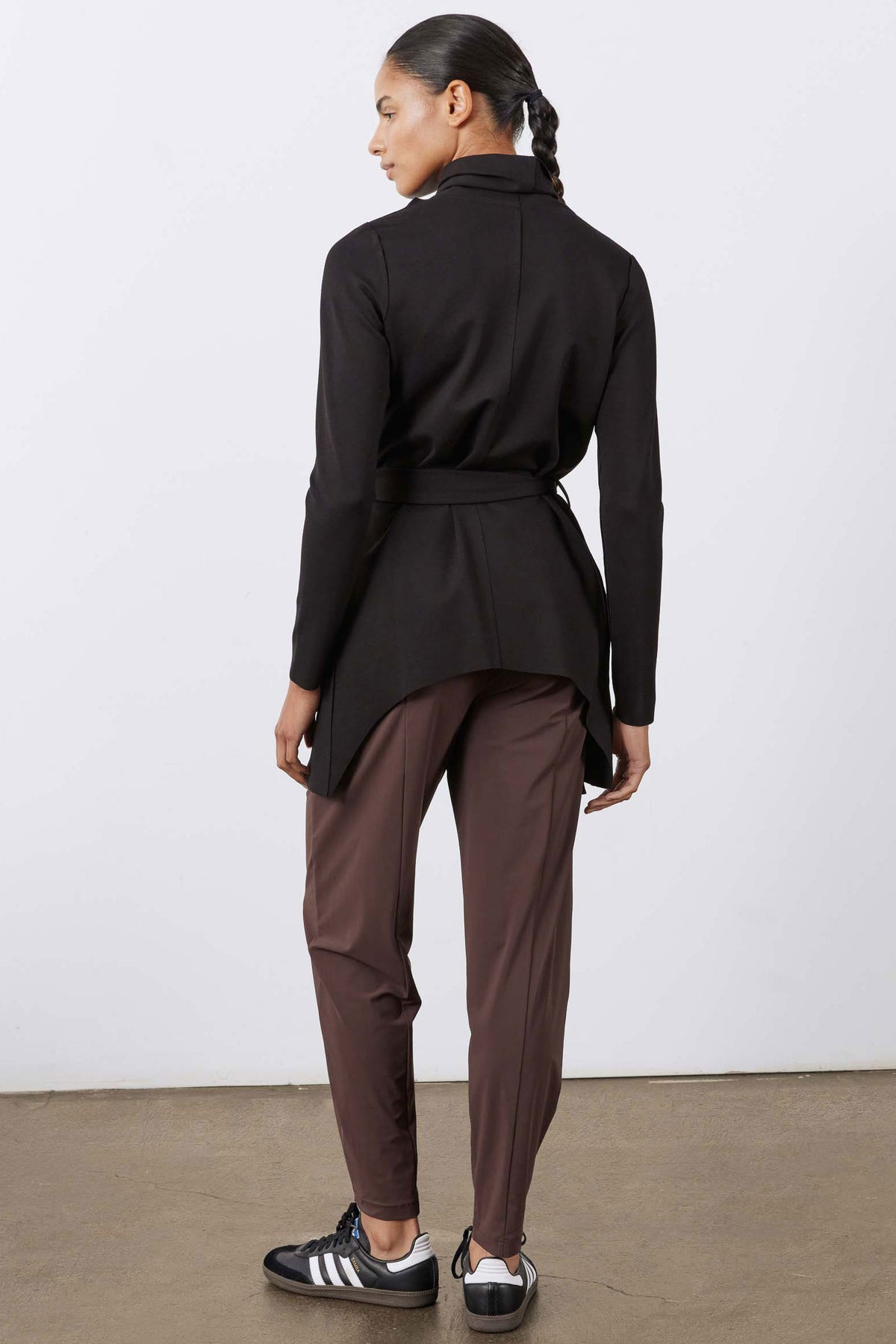Black back-view draped jacket with tied waist belt and high collar
