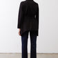 Black jacket with belted waist and clean back silhouette