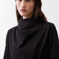 Black high-neck jacket with draped collar and front tie belt.