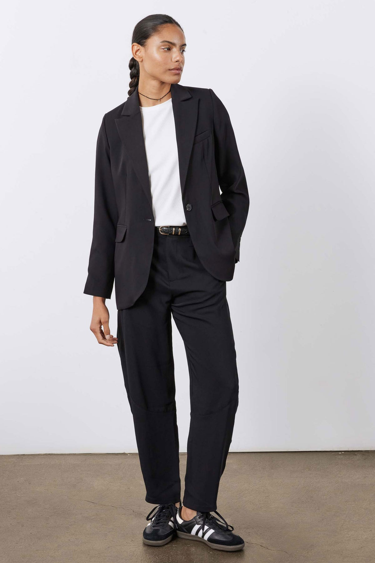 Black wide-leg formal pants, button-zip front with belt loops and flap pockets