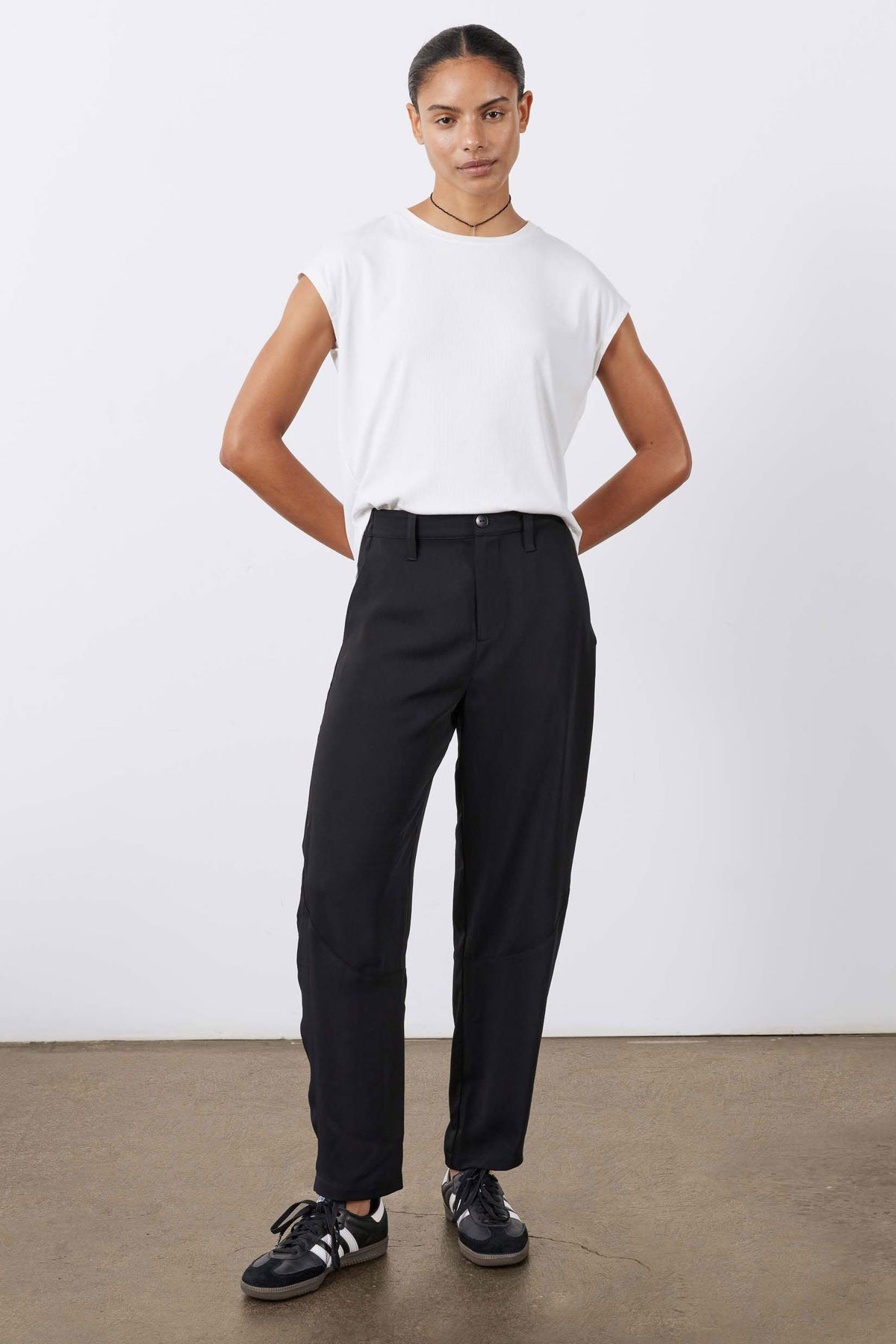 Black wide-leg formal pants with high rise and relaxed tapered ankle