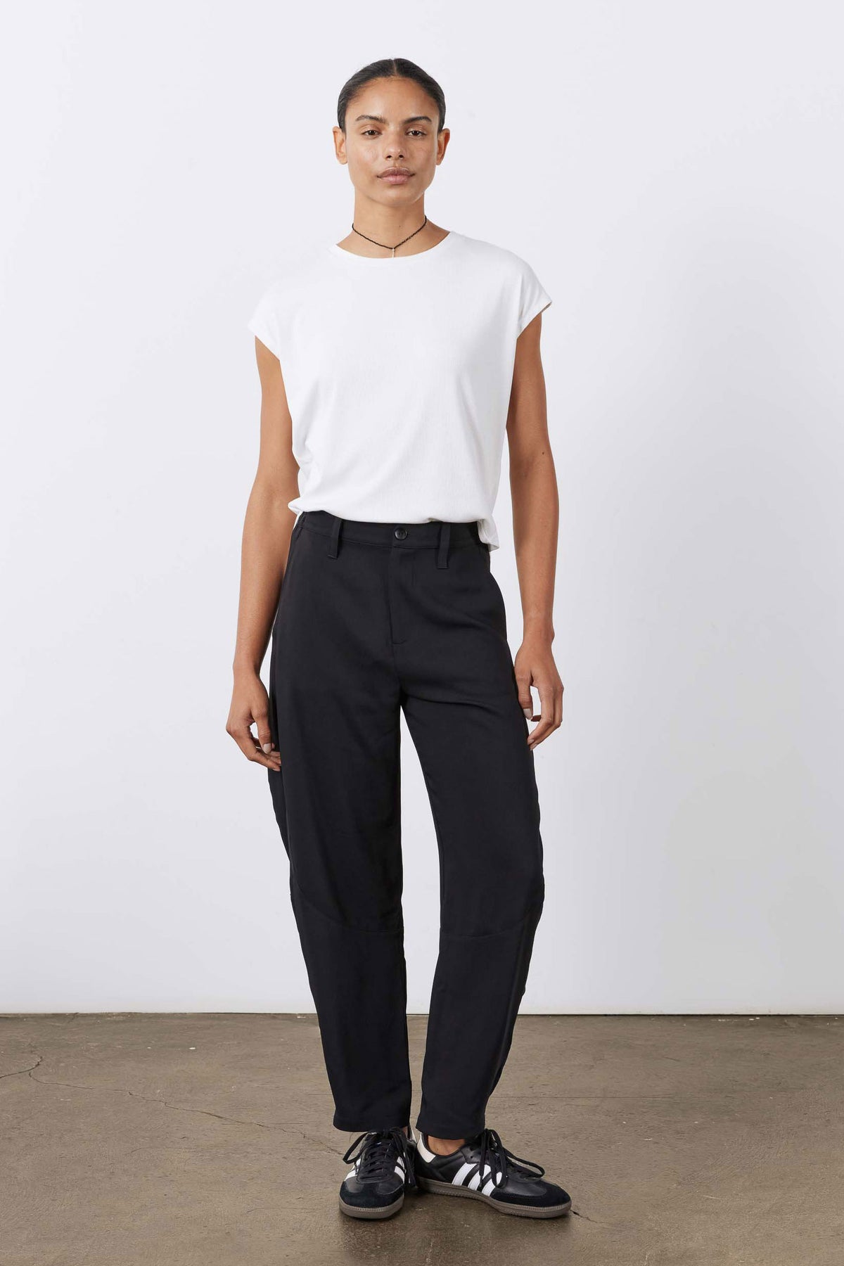 Black wide-leg formal pants with gathered waistband and relaxed straight fit