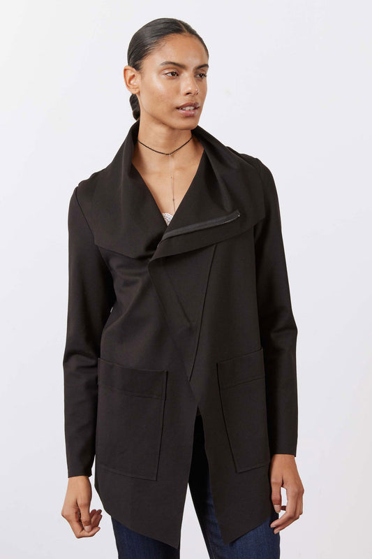 Black utility jacket with notched collar and flap chest pockets, worn open