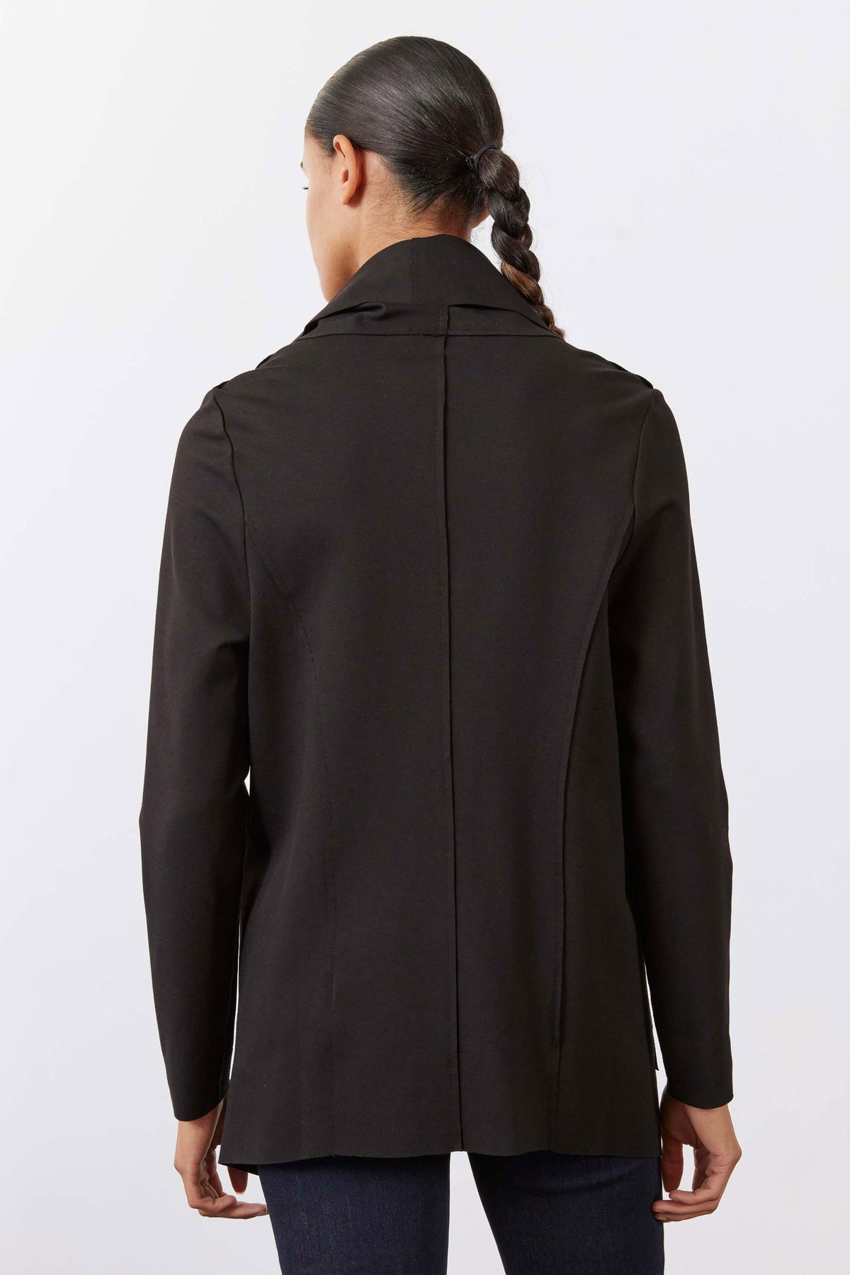 Black jacket back view with center seam and long sleeves