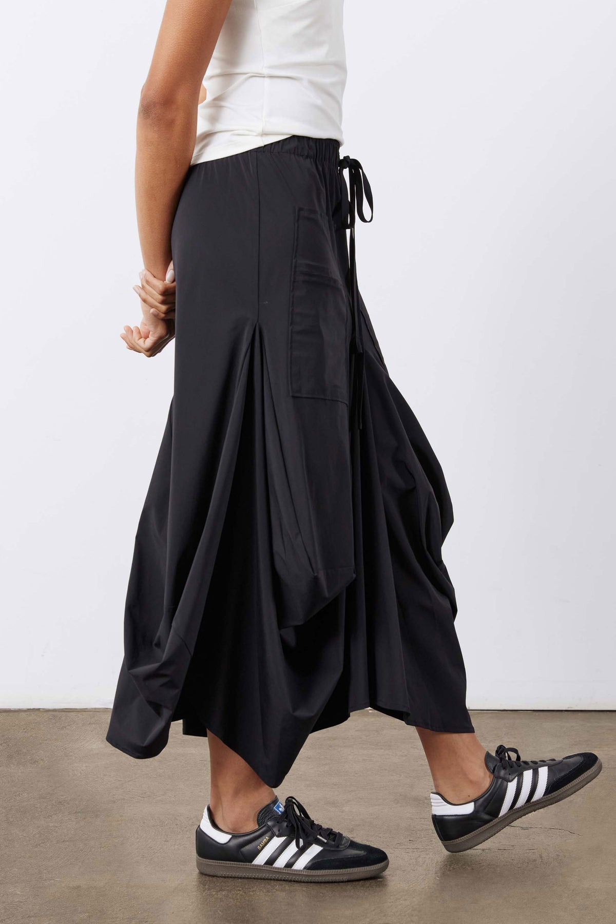 Black midi skirt with adjustable drawstring and gathered, layered skirt layers