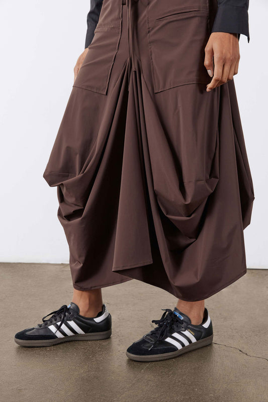 Coffee skirt with roomy patch pockets and draped, gathered panel construction.