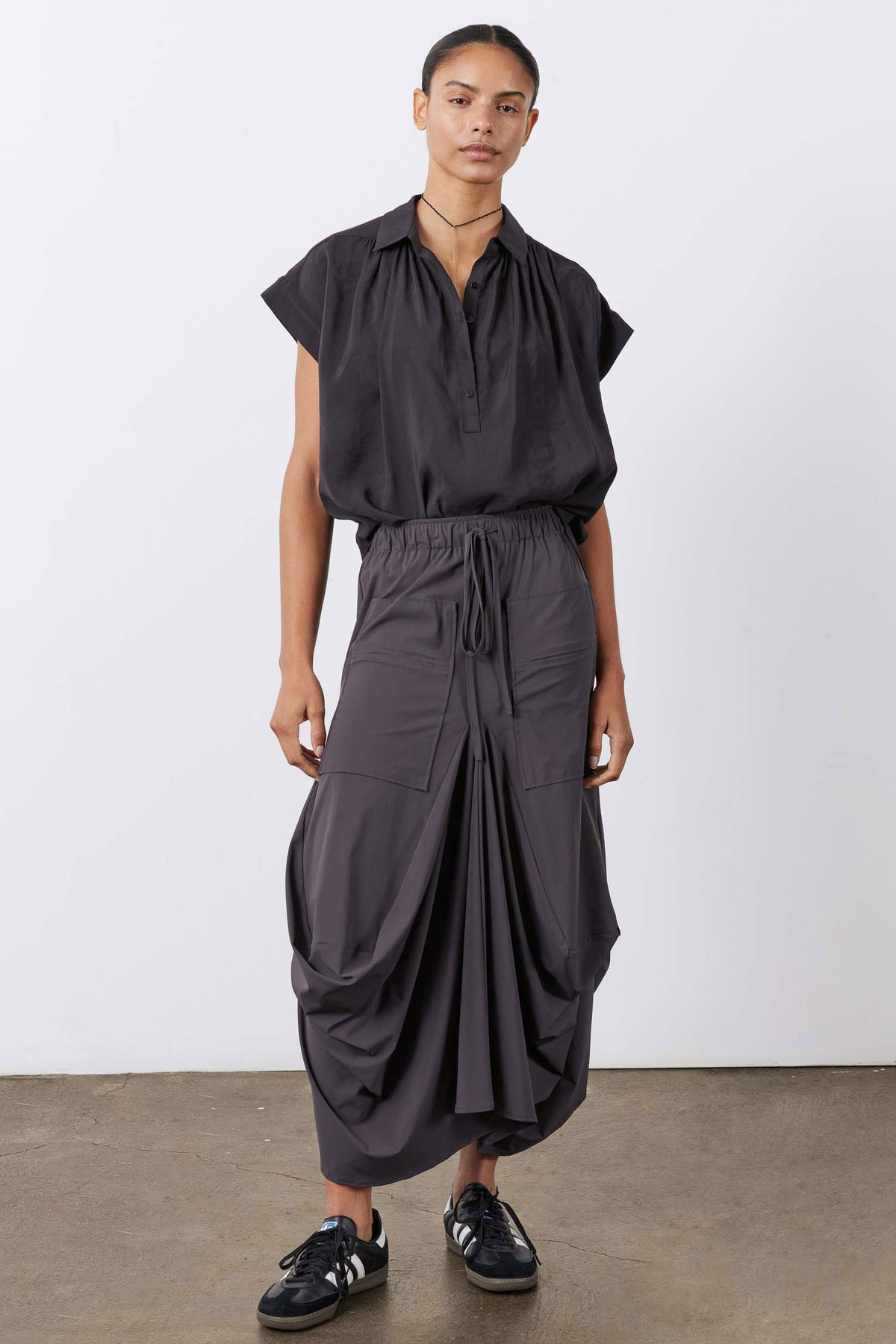 Graphite drawstring elastic-waist skirt with layered cargo panels and relaxed drape
