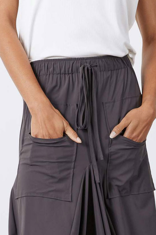 Graphite skirt detail: elastic waist with drawstring and front cargo pockets with seams