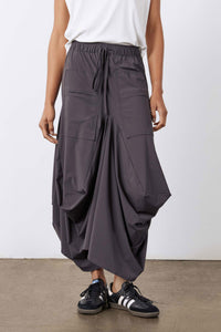 Graphite midi skirt with elastic drawstring waist and large cargo pockets, draped shape