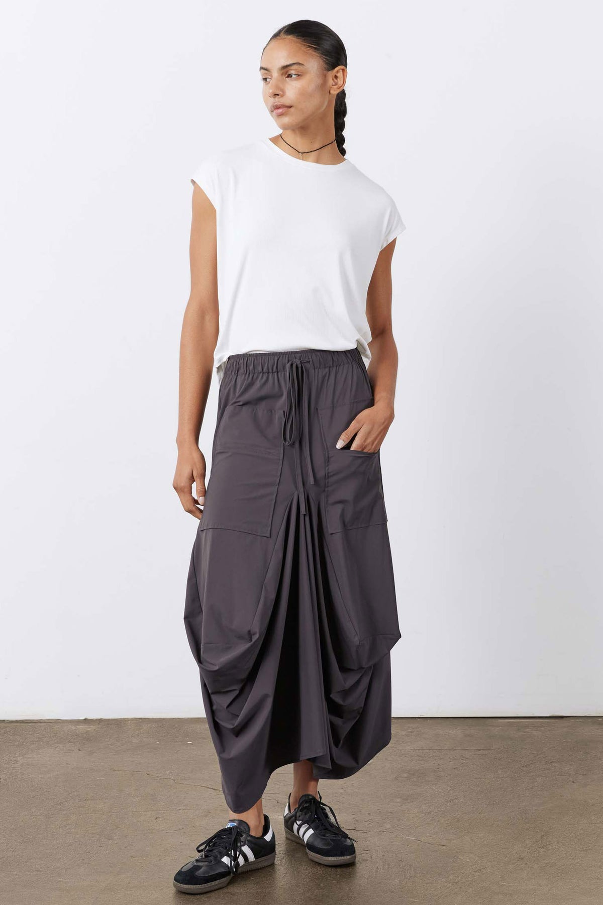 Graphite cargo-style midi skirt with elastic drawstring waist and roomy draped silhouette