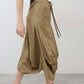 Petite go-to skirt with drawstring waist, side utility pockets, and asymmetrical drape hem