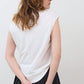 White sleeveless tee with crew neck, back view