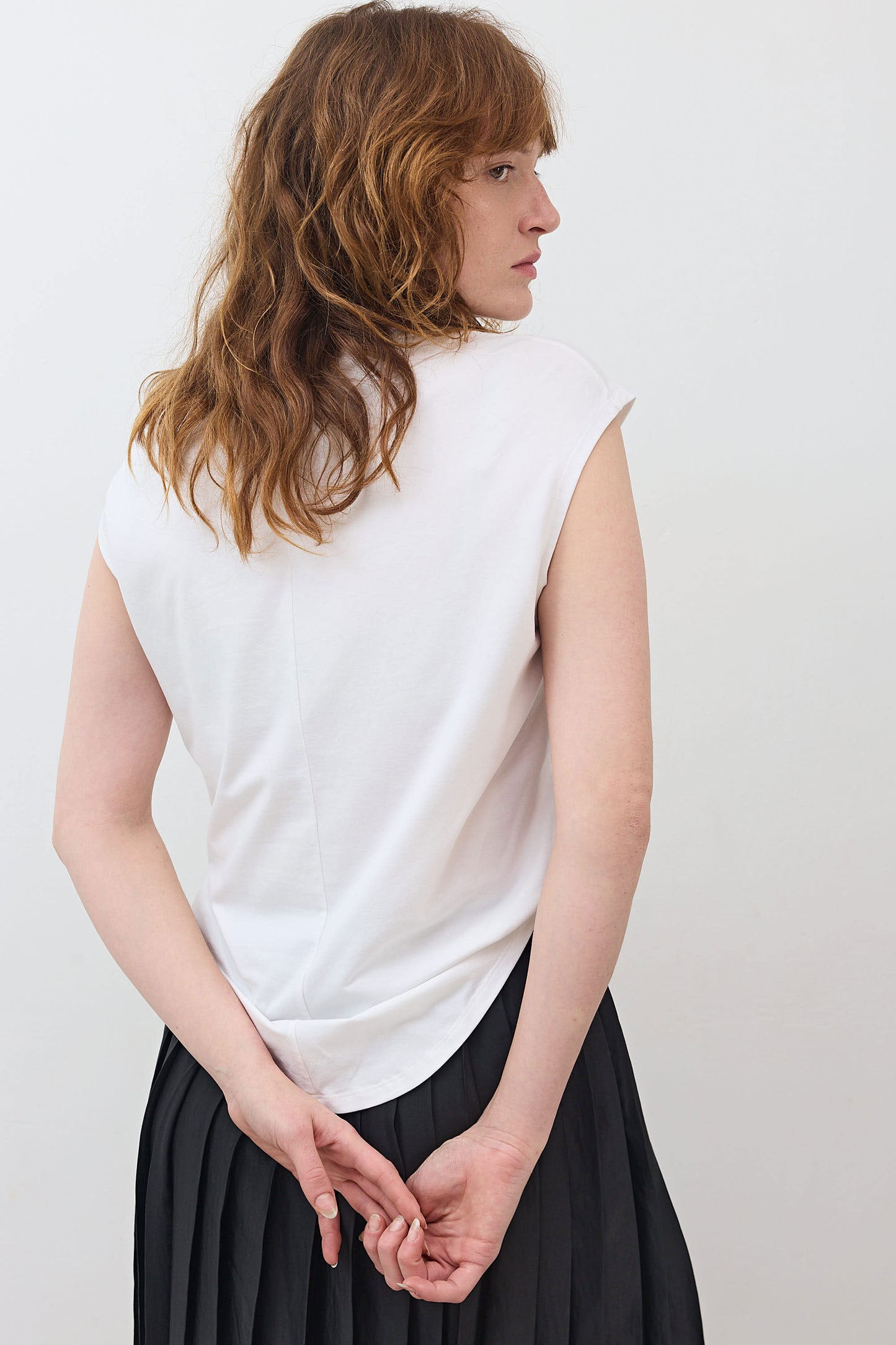 White sleeveless tee with crew neck, back view
