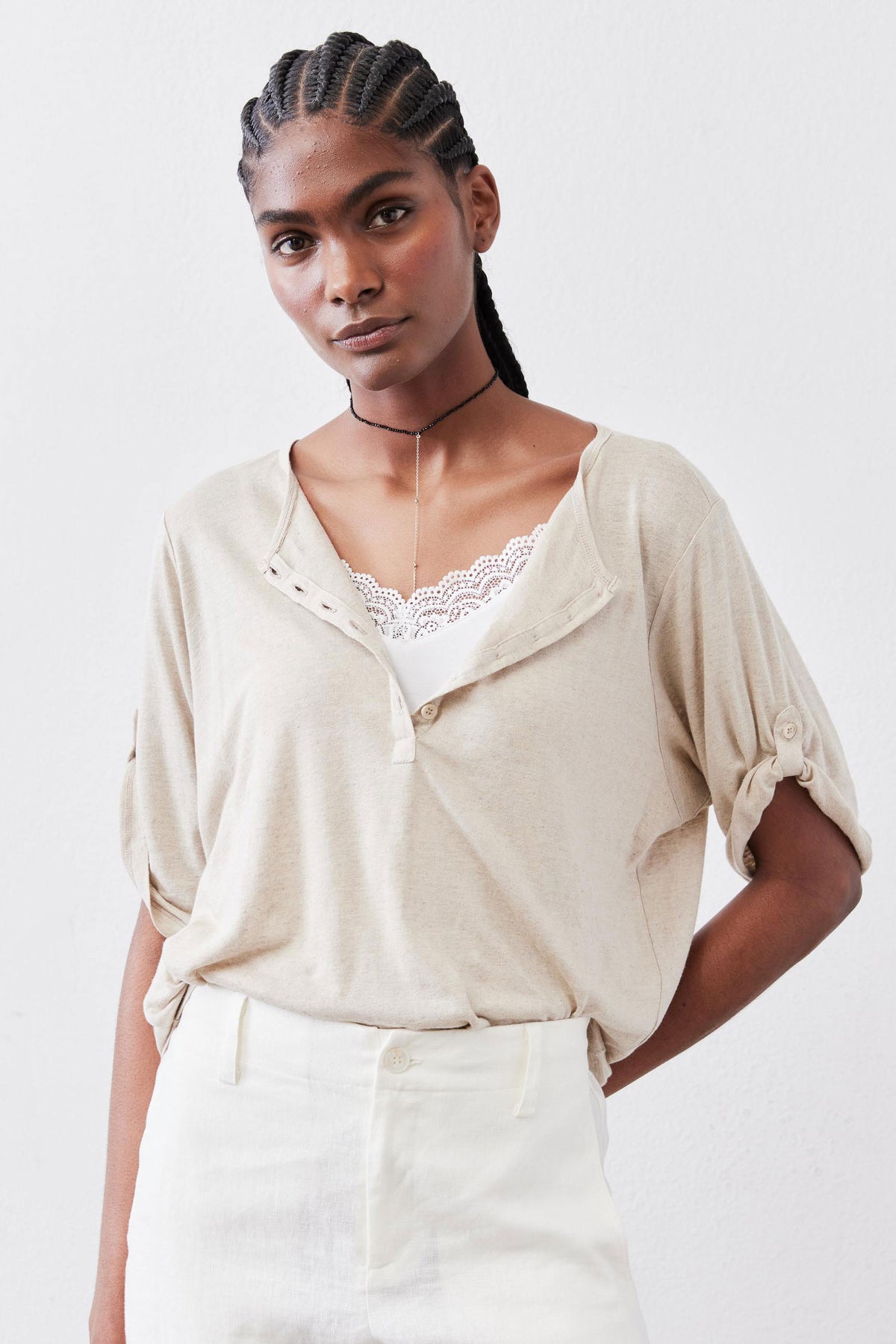 Oat half-button top with scalloped lace neckline and elbow-length sleeves