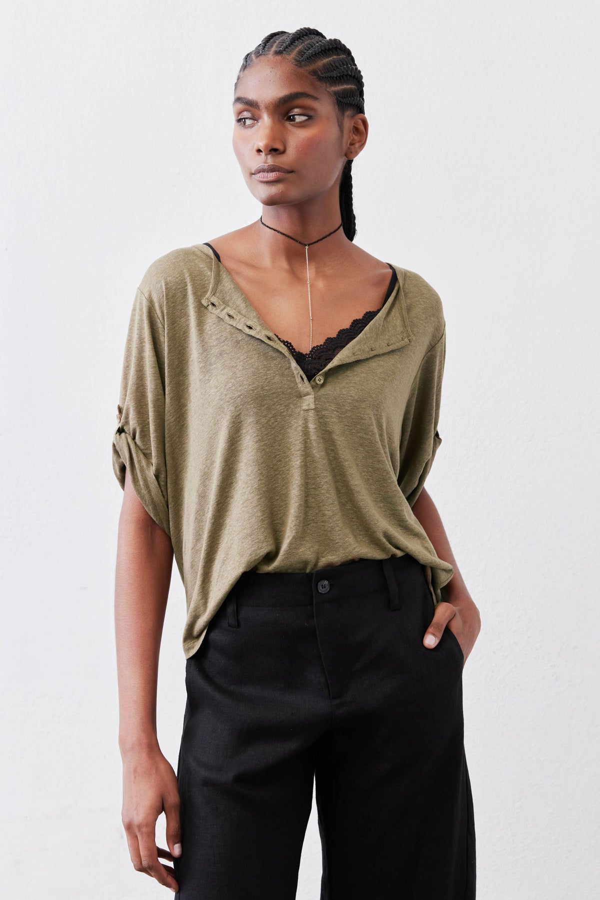 Warm olive elbow-sleeve henley top with half-button placket and V-neck