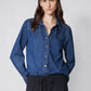 Medium-wash denim button-up shirt with pointed collar, long sleeves, and chest pocket